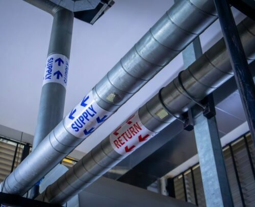 a metal pole with a bunch of signs on it